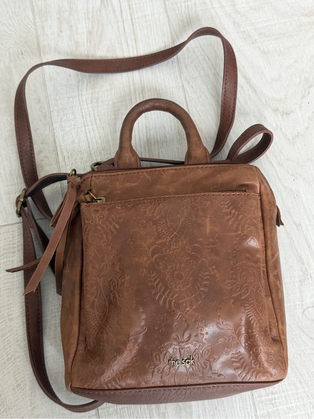 The Sak Brown Embossed Leather mini backpack